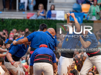 Castellers de Berga celebrates a human castle during the Concurs de Castells competition in Tarragona, Spain, on October 5, 2024. (