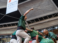 Castellers de Sant Cugat participate in the Concurs de Castells competition in Tarragona, Spain, on October 5, 2024. (