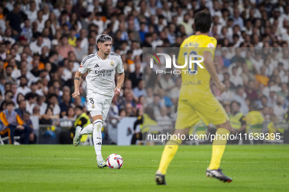 Federico Valverde of Real Madrid CF is in action with the ball during the La Liga EA Sports 2024/25 football match between Real Madrid CF an...