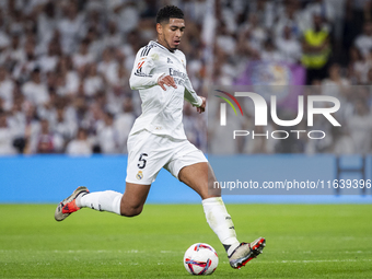 Jude Bellingham of Real Madrid CF is in action with the ball during the La Liga EA Sports 2024/25 football match between Real Madrid CF and...