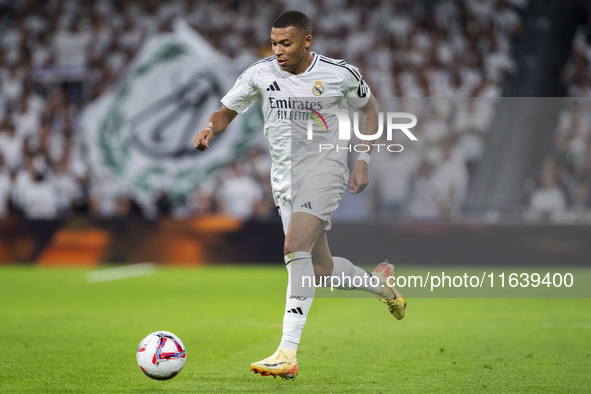 Kylian Mbappe of Real Madrid CF is in action with the ball during the La Liga EA Sports 2024/25 football match between Real Madrid CF and Vi...