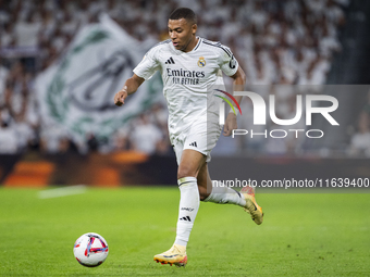 Kylian Mbappe of Real Madrid CF is in action with the ball during the La Liga EA Sports 2024/25 football match between Real Madrid CF and Vi...