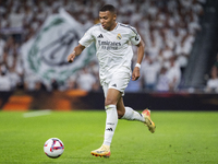 Kylian Mbappe of Real Madrid CF is in action with the ball during the La Liga EA Sports 2024/25 football match between Real Madrid CF and Vi...