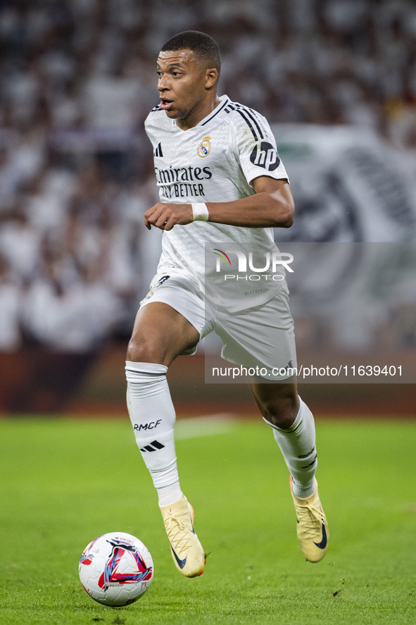 Kylian Mbappe of Real Madrid CF is in action with the ball during the La Liga EA Sports 2024/25 football match between Real Madrid CF and Vi...