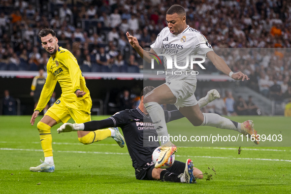 Kylian Mbappe of Real Madrid CF is in action with the ball during the La Liga EA Sports 2024/25 football match between Real Madrid CF and Vi...