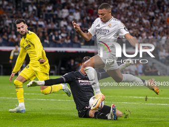 Kylian Mbappe of Real Madrid CF is in action with the ball during the La Liga EA Sports 2024/25 football match between Real Madrid CF and Vi...