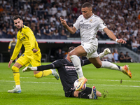 Kylian Mbappe of Real Madrid CF is in action with the ball during the La Liga EA Sports 2024/25 football match between Real Madrid CF and Vi...