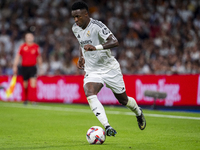 Vinicius Junior of Real Madrid CF is in action with the ball during the La Liga EA Sports 2024/25 football match between Real Madrid CF and...