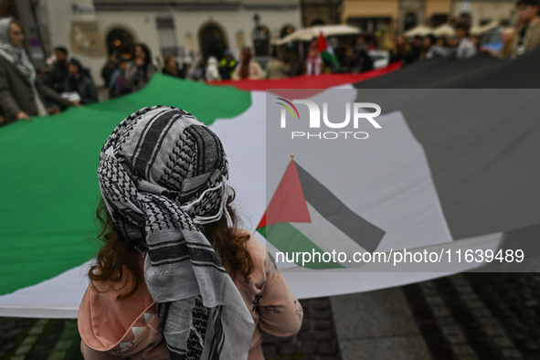 KRAKOW, POLAND - OCTOBER 5:
Pro-Palestinian activists gather in Krakow's UNESCO-listed Old Town for the 'March for Palestine,' calling for a...