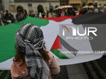 KRAKOW, POLAND - OCTOBER 5:
Pro-Palestinian activists gather in Krakow's UNESCO-listed Old Town for the 'March for Palestine,' calling for a...