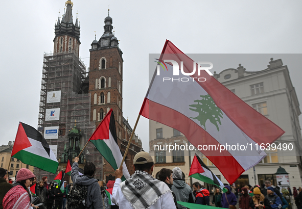 KRAKOW, POLAND - OCTOBER 5:
Pro-Palestinian activists gather in Krakow's UNESCO-listed Old Town for the 'March for Palestine,' calling for a...