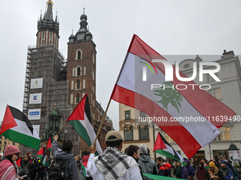 KRAKOW, POLAND - OCTOBER 5:
Pro-Palestinian activists gather in Krakow's UNESCO-listed Old Town for the 'March for Palestine,' calling for a...