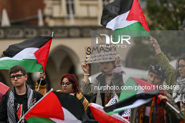 KRAKOW, POLAND - OCTOBER 5:
Pro-Palestinian activists gather in Krakow's UNESCO-listed Old Town for the 'March for Palestine,' calling for a...