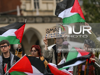 KRAKOW, POLAND - OCTOBER 5:
Pro-Palestinian activists gather in Krakow's UNESCO-listed Old Town for the 'March for Palestine,' calling for a...