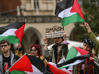 KRAKOW, POLAND - OCTOBER 5:
Pro-Palestinian activists gather in Krakow's UNESCO-listed Old Town for the 'March for Palestine,' calling for a...