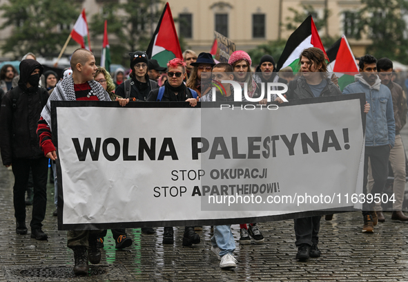 KRAKOW, POLAND - OCTOBER 5:
Pro-Palestinian activists gather in Krakow's UNESCO-listed Old Town for the 'March for Palestine,' calling for a...