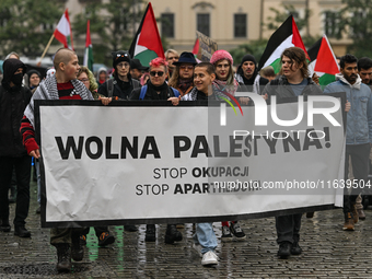 KRAKOW, POLAND - OCTOBER 5:
Pro-Palestinian activists gather in Krakow's UNESCO-listed Old Town for the 'March for Palestine,' calling for a...