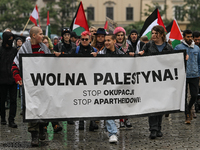 KRAKOW, POLAND - OCTOBER 5:
Pro-Palestinian activists gather in Krakow's UNESCO-listed Old Town for the 'March for Palestine,' calling for a...