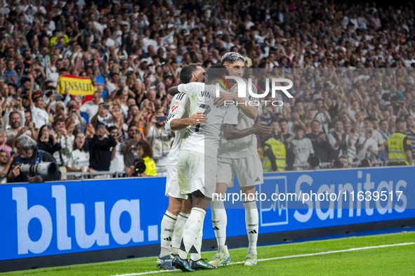 Vinicius Junior of Real Madrid CF celebrates his goal with his teammates Daniel Carvajal (L) and Federico Valverde (R) during the La Liga EA...