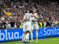 Vinicius Junior of Real Madrid CF celebrates his goal with his teammates Daniel Carvajal (L) and Federico Valverde (R) during the La Liga EA...