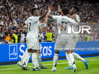 Vinicius Junior of Real Madrid CF celebrates his goal with his teammates Rodrygo Silva de Goes and Aurelien Tchouameni during the La Liga EA...