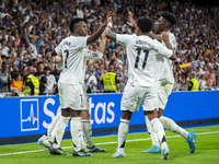 Vinicius Junior of Real Madrid CF celebrates his goal with his teammates Rodrygo Silva de Goes and Aurelien Tchouameni during the La Liga EA...