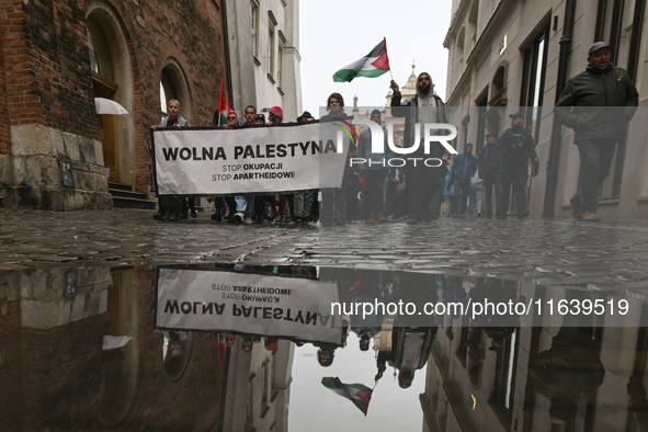 KRAKOW, POLAND - OCTOBER 5:
Pro-Palestinian activists gather in Krakow's UNESCO-listed Old Town for the 'March for Palestine,' calling for a...