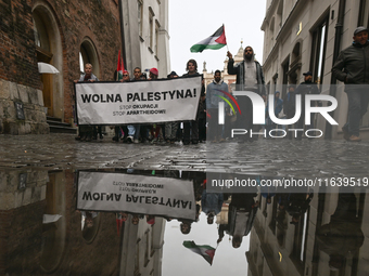 KRAKOW, POLAND - OCTOBER 5:
Pro-Palestinian activists gather in Krakow's UNESCO-listed Old Town for the 'March for Palestine,' calling for a...