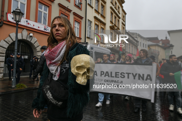 KRAKOW, POLAND - OCTOBER 5:
Pro-Palestinian activists gathered in front of the American Consulate in Krakow's UNESCO-listed Old Town during...