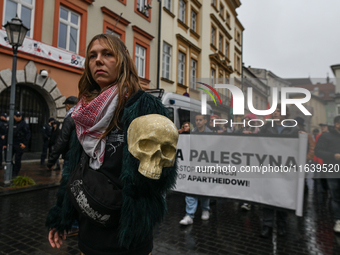 KRAKOW, POLAND - OCTOBER 5:
Pro-Palestinian activists gathered in front of the American Consulate in Krakow's UNESCO-listed Old Town during...