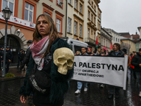 KRAKOW, POLAND - OCTOBER 5:
Pro-Palestinian activists gathered in front of the American Consulate in Krakow's UNESCO-listed Old Town during...