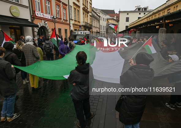 KRAKOW, POLAND - OCTOBER 5:
Pro-Palestinian activists gathered in front of the American Consulate in Krakow's UNESCO-listed Old Town during...