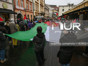 KRAKOW, POLAND - OCTOBER 5:
Pro-Palestinian activists gathered in front of the American Consulate in Krakow's UNESCO-listed Old Town during...