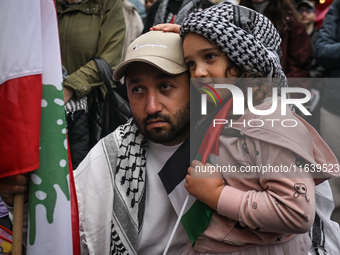 KRAKOW, POLAND - OCTOBER 5:
Pro-Palestinian activists gathered in front of the American Consulate in Krakow's UNESCO-listed Old Town during...