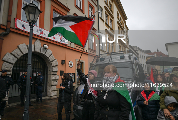 KRAKOW, POLAND - OCTOBER 5:
Pro-Palestinian activists gathered in front of the American Consulate in Krakow's UNESCO-listed Old Town during...