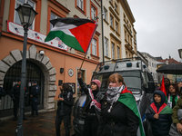 KRAKOW, POLAND - OCTOBER 5:
Pro-Palestinian activists gathered in front of the American Consulate in Krakow's UNESCO-listed Old Town during...