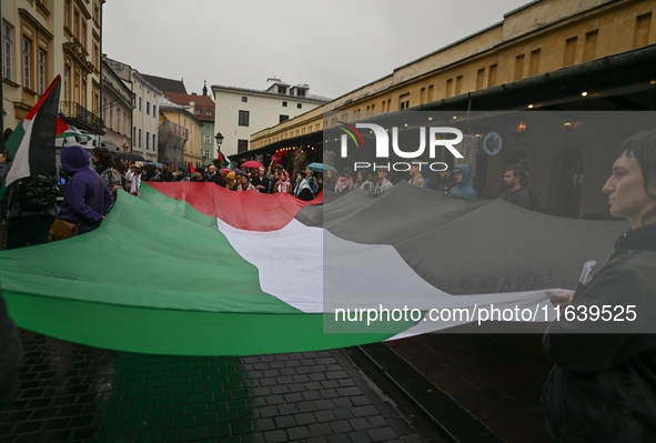 KRAKOW, POLAND - OCTOBER 5:
Pro-Palestinian activists gathered in front of the American Consulate in Krakow's UNESCO-listed Old Town during...