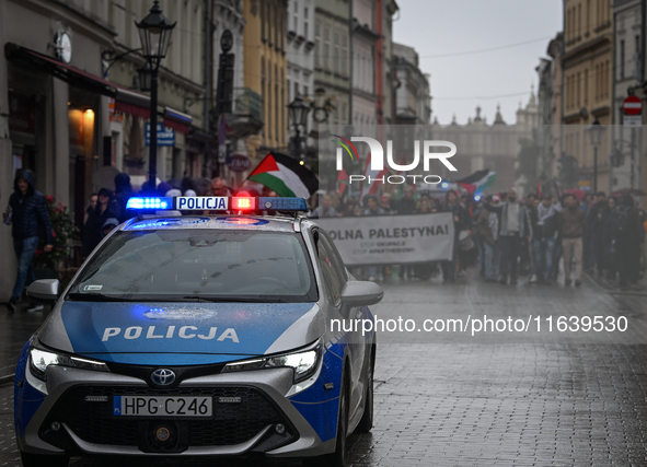 KRAKOW, POLAND - OCTOBER 5:
Pro-Palestinian activists gather in Krakow's UNESCO-listed Old Town for the 'March for Palestine,' calling for a...