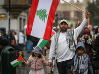 KRAKOW, POLAND - OCTOBER 5:
Pro-Palestinian and pro-Lebanon activists gather in Krakow's UNESCO-listed Old Town for the 'March for Palestine...