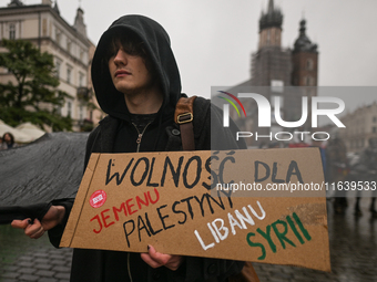 KRAKOW, POLAND - OCTOBER 5:
Pro-Palestinian activists gather in Krakow's UNESCO-listed Old Town for the 'March for Palestine,' calling for a...