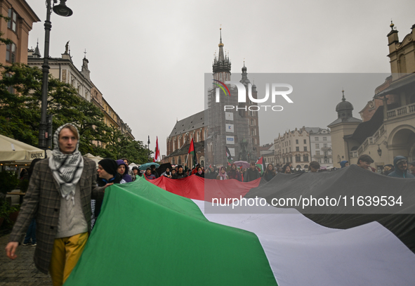 KRAKOW, POLAND - OCTOBER 5:
Pro-Palestinian activists gather in Krakow's UNESCO-listed Old Town for the 'March for Palestine,' calling for a...