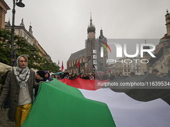 KRAKOW, POLAND - OCTOBER 5:
Pro-Palestinian activists gather in Krakow's UNESCO-listed Old Town for the 'March for Palestine,' calling for a...