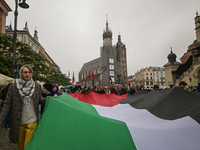 KRAKOW, POLAND - OCTOBER 5:
Pro-Palestinian activists gather in Krakow's UNESCO-listed Old Town for the 'March for Palestine,' calling for a...