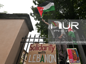 KRAKOW, POLAND - OCTOBER 5:
Pro-Palestinian activists gathered in front of the fence of the Institute of Sociology at Jagiellonian Universit...