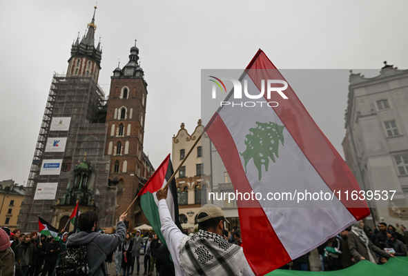 KRAKOW, POLAND - OCTOBER 5:
Pro-Palestinian activists gather in Krakow's UNESCO-listed Old Town for the 'March for Palestine,' calling for a...