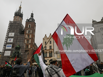 KRAKOW, POLAND - OCTOBER 5:
Pro-Palestinian activists gather in Krakow's UNESCO-listed Old Town for the 'March for Palestine,' calling for a...