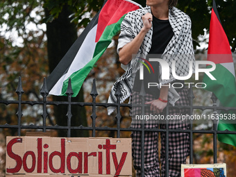 KRAKOW, POLAND - OCTOBER 5:
Pro-Palestinian activists gathered in front of the fence of the Institute of Sociology at Jagiellonian Universit...