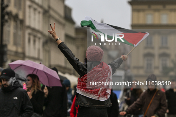 KRAKOW, POLAND - OCTOBER 5:
Pro-Palestinian activists gather in Krakow's UNESCO-listed Old Town for the 'March for Palestine,' calling for a...