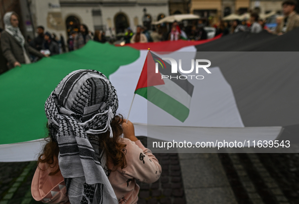 KRAKOW, POLAND - OCTOBER 5:
Pro-Palestinian activists gather in Krakow's UNESCO-listed Old Town for the 'March for Palestine,' calling for a...