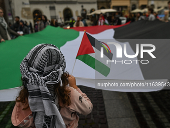 KRAKOW, POLAND - OCTOBER 5:
Pro-Palestinian activists gather in Krakow's UNESCO-listed Old Town for the 'March for Palestine,' calling for a...